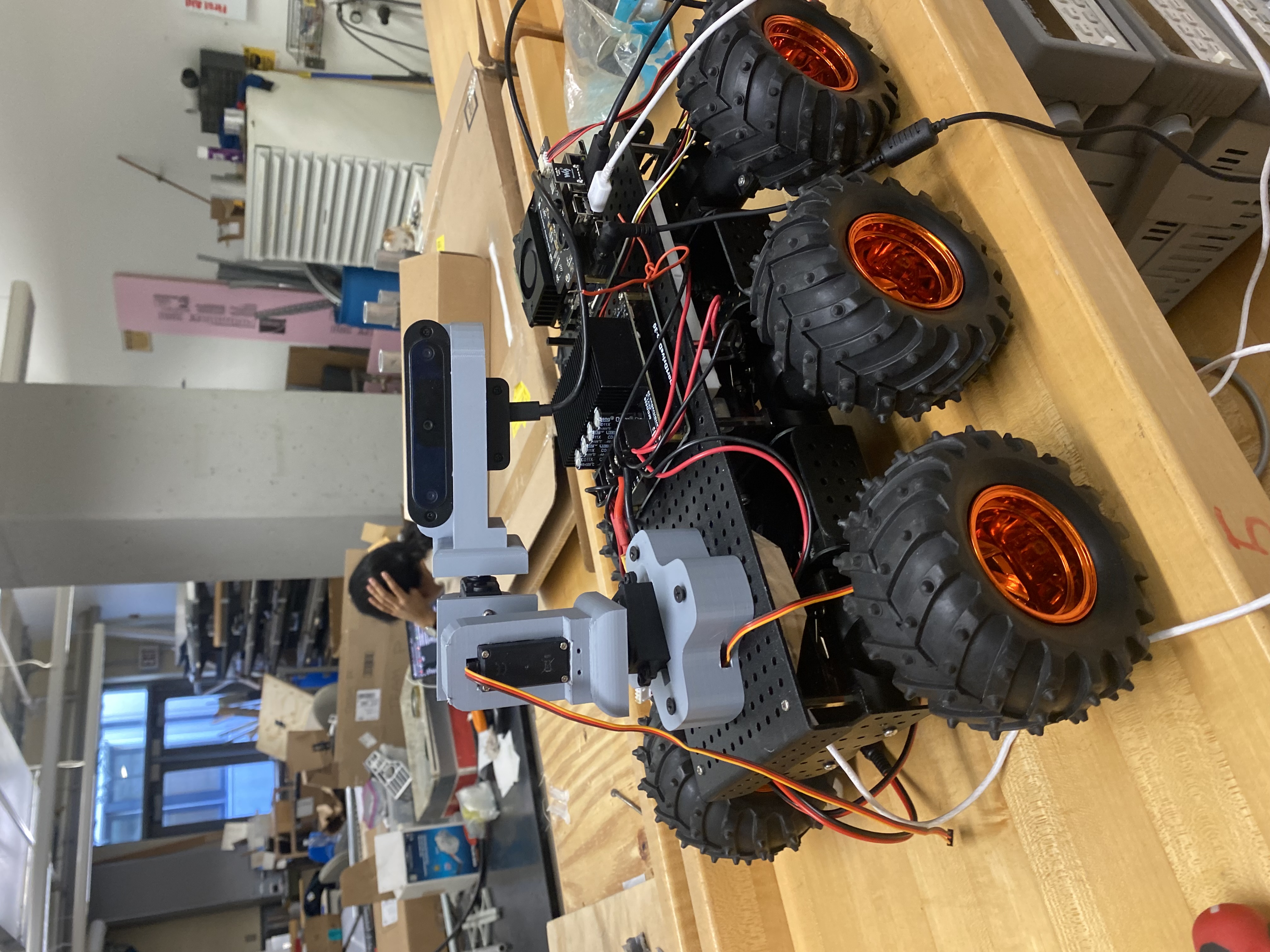 Autonomous surveillance rover with mounted camera and arm
